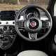 Fiat 500C (2023) review: steering wheel and gauge cluster, black and white upholstery