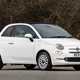 Fiat 500C (2023) review: front three quarter static, white car, wood in background
