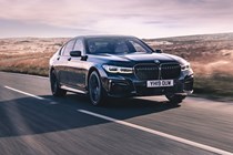 BMW 7 Series review, front view, driving, dark
