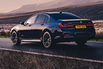 BMW 7 Series review, rear view, driving, dark