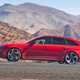 Red 2020 Audi RS 4 Avant side elevation driving