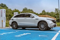 White 2019 Mercedes-Benz EQC front three-quarter on charge