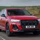 Audi Q7 (2025) review: front three quarter driving, red paint