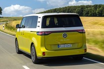 Volkswagen ID. Buzz LWB: rear three quarter driving, low angle, German plates, yellow and white paint