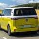 Volkswagen ID. Buzz LWB: rear three quarter driving, low angle, German plates, yellow and white paint