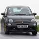 Abarth 695 (2024) review: front three quarter driving, black paint