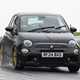 Abarth 695 (2024) review: front three quarter cornering, rain, black paint