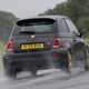 Abarth 695 (2024) review: rear three quarter cornering, rain, black paint