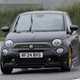 Abarth 695 (2024) review: front three quarter cornering, close up, rain, black paint