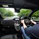 Abarth 695 (2024) review: interior driving, Luke Wilkinson at the wheel, black upholstery