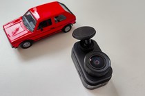 Garmin Dash Cam Mini 2 next to a toy car