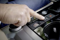 Man pressing park assist button on Volkswagen Touareg