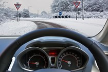 Driver-eye view of snowy road - What are snow chains