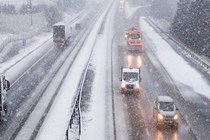 Image of traffic on a snowy dual-carriageway