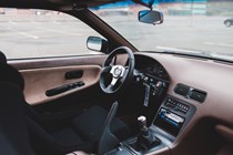 Car interior with manual lever handbrake
