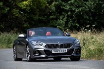 Image of a BMW Z4, in grey, driving round a corner