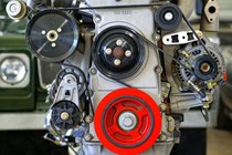 Vehicle engine with alternator belt