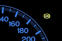 Image of the ABS warning light in a car's instrument cluster