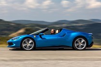 Best hardtop convertible cars 2024: Ferrari 296 GTS, side view driving, blue paint