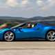 Best hardtop convertible cars 2024: Ferrari 296 GTS, side view driving, blue paint