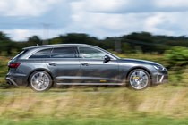 Best estate cars 2024: Audi A4 Avant, side view driving, dark grey paint, British road