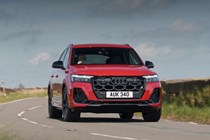 The best seven-seaters in 2025: Audi Q7, front three quarter cornering, red paint