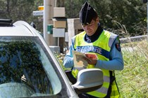 Gendarme issuing fine - Driving in Europe