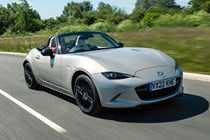 Best cheap fast cars in 2024: Mazda MX-5, front three quarter driving, silver paint