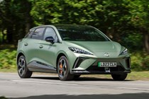 Best cheap fast cars in 2024: MG 4 EV, front three quarter driving, green paint