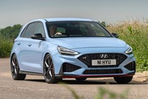 Best cheap fast cars in 2024: Hyundai i30 N, front three quarter cornering, blue paint