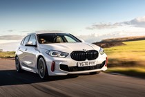 Best cheap fast cars in 2024: BMW 128ti, front three quarter driving, white paint