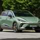 Best cheap fast cars in 2024: MG 4 EV, front three quarter driving, green paint