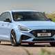 Best cheap fast cars in 2024: Hyundai i30 N, front three quarter cornering, blue paint