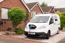 Image of a Nissan e-NV200 campervan on charge