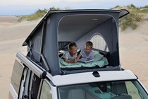 Image of two children in the upper bed of a Volkswagen California