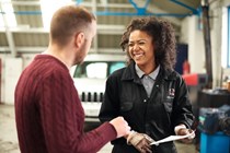 Mechanic speaking with customer - What is a car service