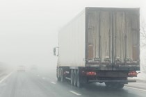 Image of a lorry driving heavy fog