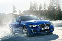 BMW 3 Series driving in the rain