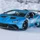 Lamborghini winter driving, front three quarter action, huge snowy skid