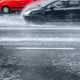 Image of cars driving in very heavy rain