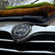 Three drying towels resting on a Lancia's bonnet