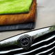 The three drying towels on a car bonnet