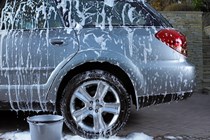 Soap suds and water on car