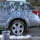 Soap suds and water on car