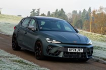 Cupra Leon (2025) review: front three quarter driving, matte grey paint, close up