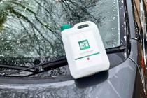 The Autoglym car shampoo bottle on a car