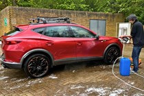 Aaron Hussain rinsing a Cupra Formentor