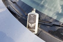 Car Gods shampoo sitting next to windscreen wiper