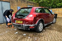 Cleaning a red car using the Meguiar's shampoo