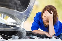 Woman with broken down car - How to change engine oil